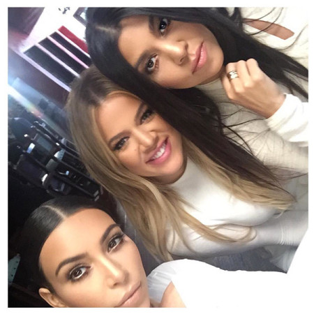 Kim Kardashian, along with sister Kourtney and Scott Disick