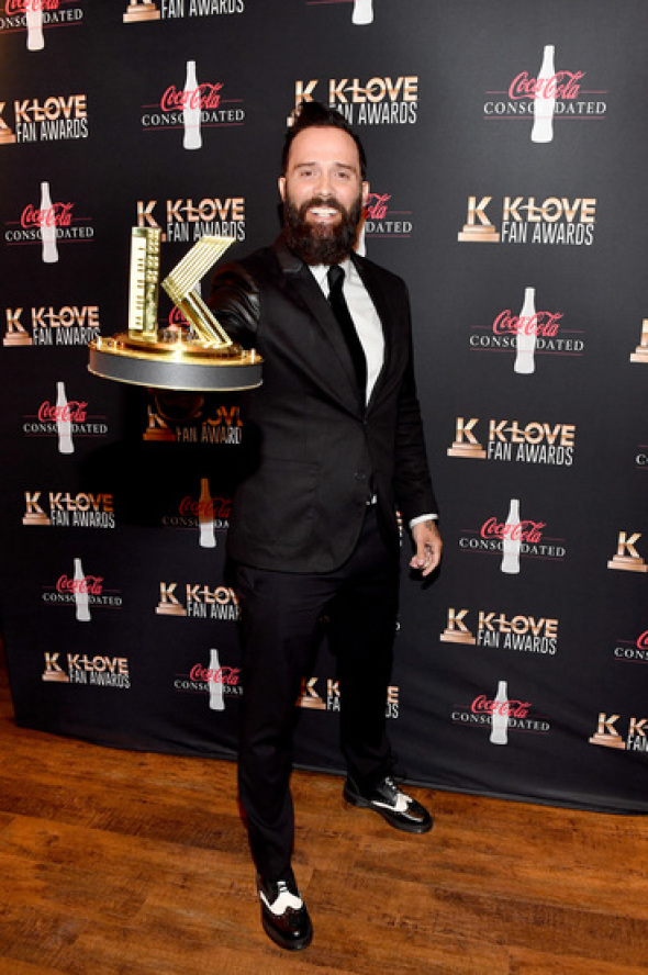 Skillet's John Cooper with his Book Impact Award for 